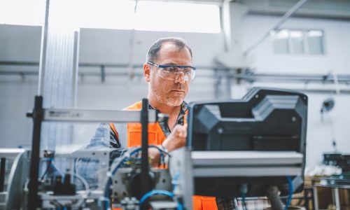 worker on automated plant floor